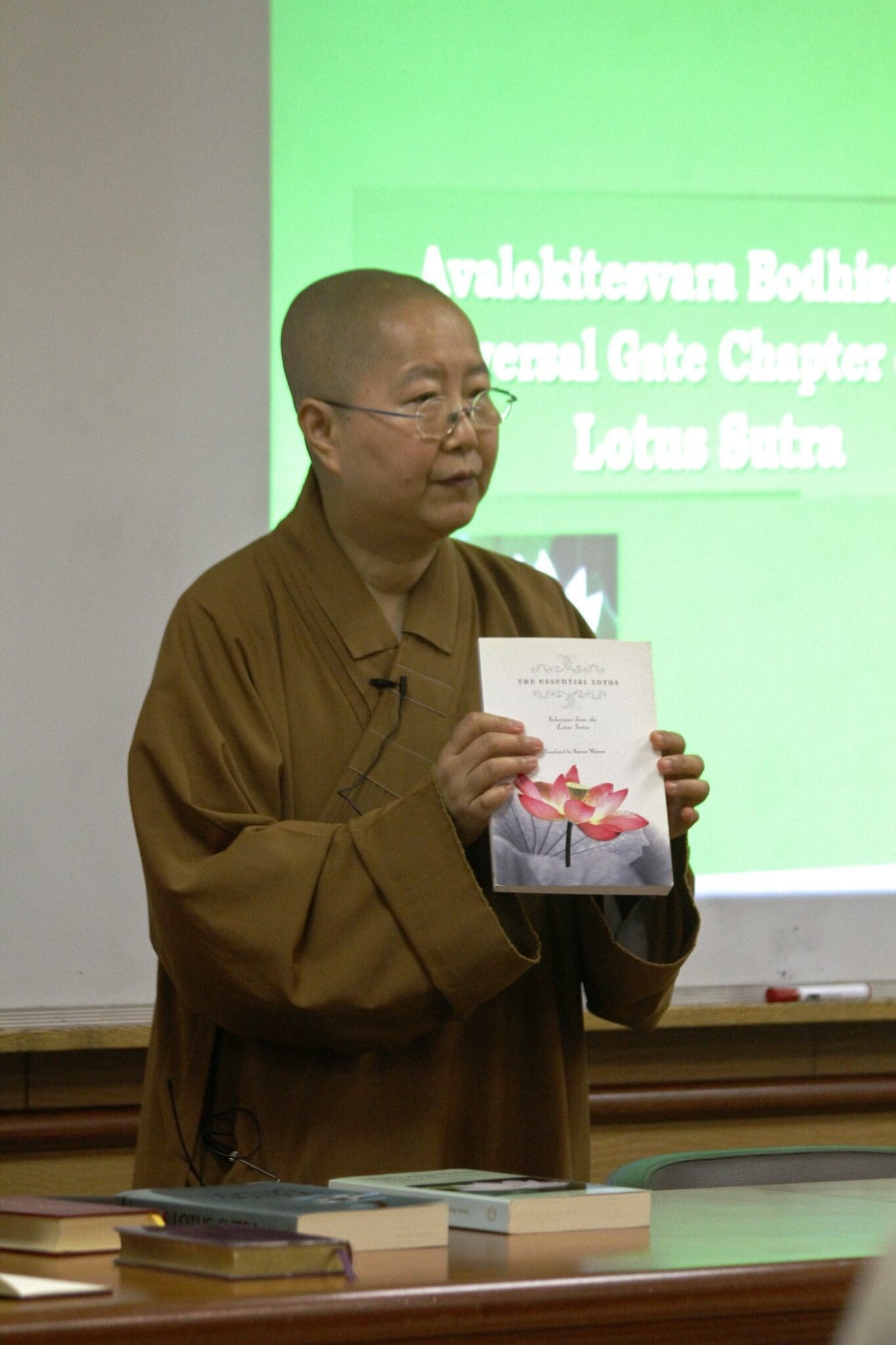 Venerable Miaoshi displays a Lotus Sutra Translation