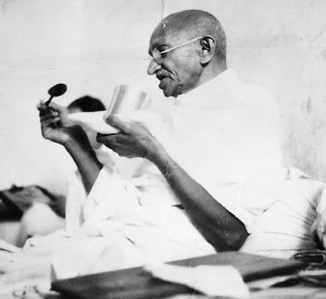 Mahatma_Gandhi_taking_his_last_meal_before_the_start_of_his_fast_-_1939